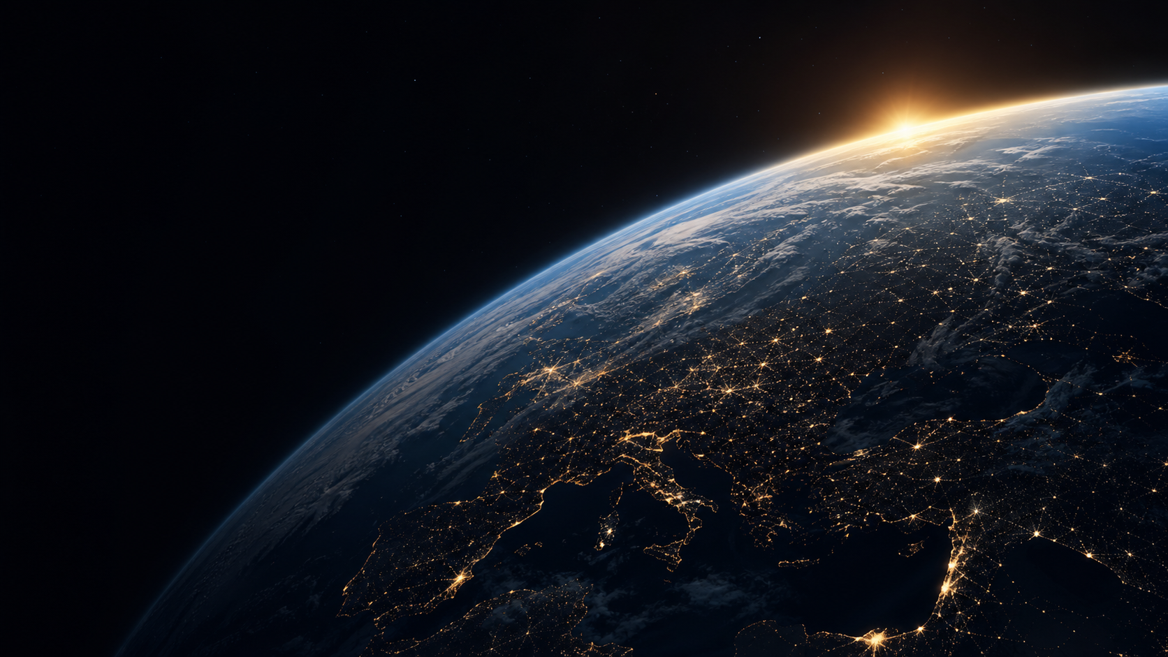Earth viewed from space with city lights and sunrise on the horizon